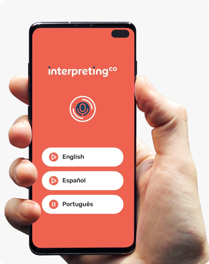 hand holding mobile phone displaying simultaneous interpretation app with English, Spanish & Portuguese as available languages