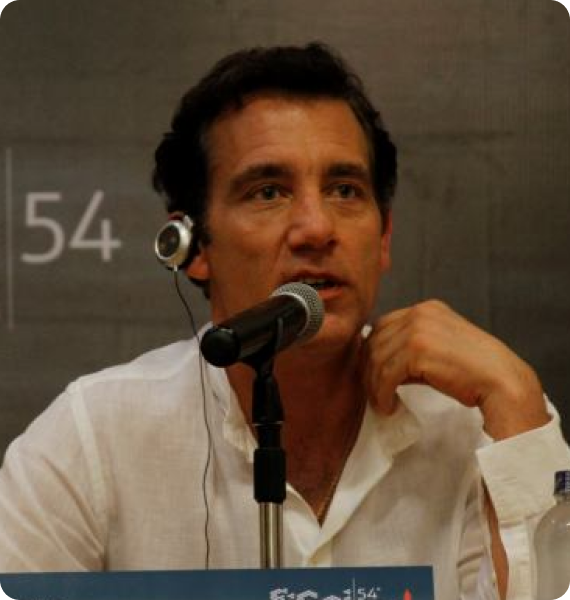 Owen: Clive Owen wears earphones to listen to Spanish to English simultaneous interpretation in Cartagena, Colombia